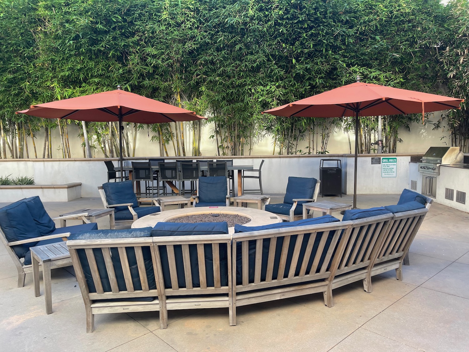 a group of chairs around a fire pit