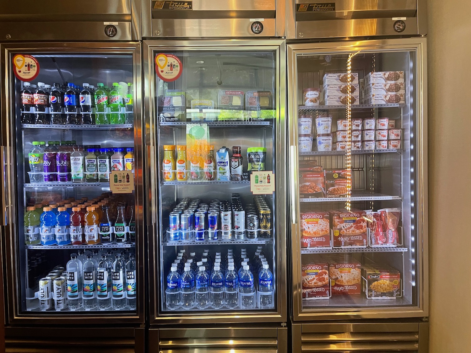 a refrigerator with drinks and beverages