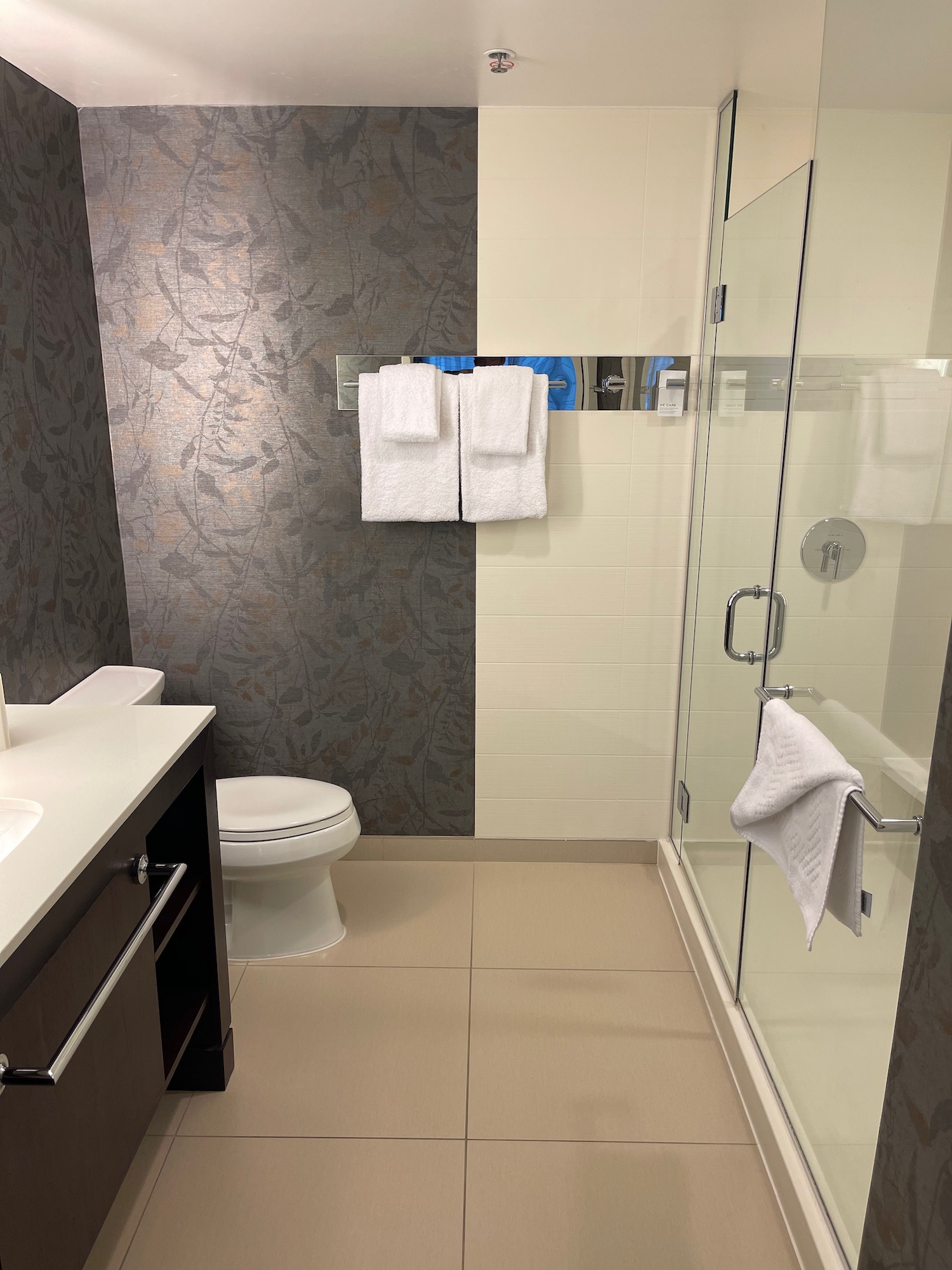 a bathroom with a shower and toilet