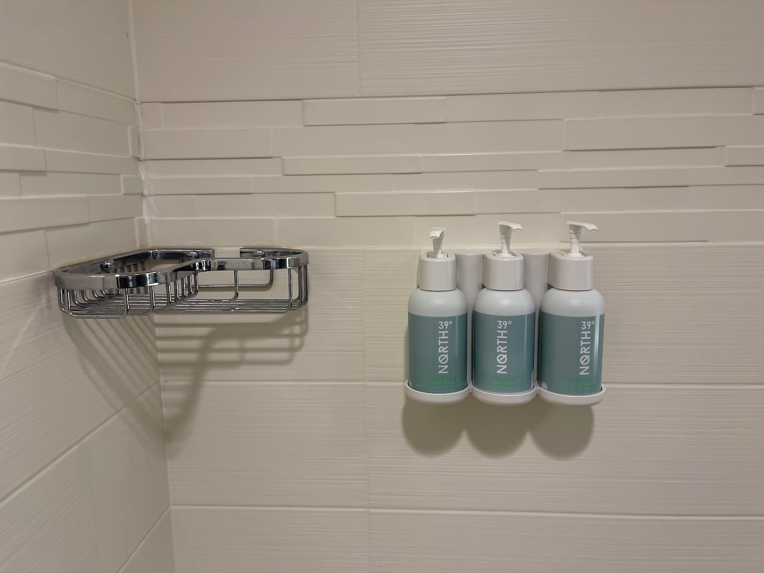 a group of soap dispensers on a wall