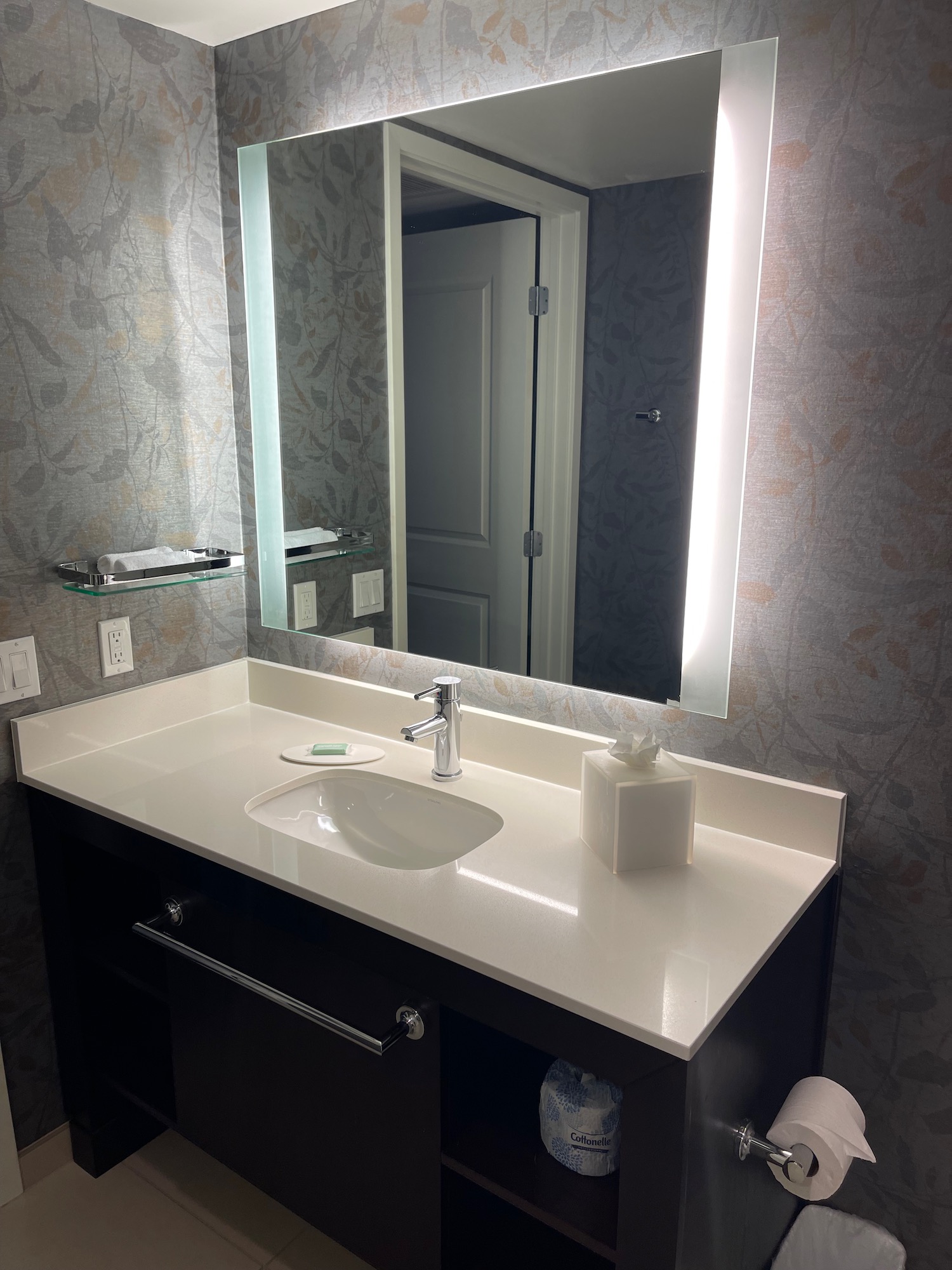 a bathroom with a mirror and sink