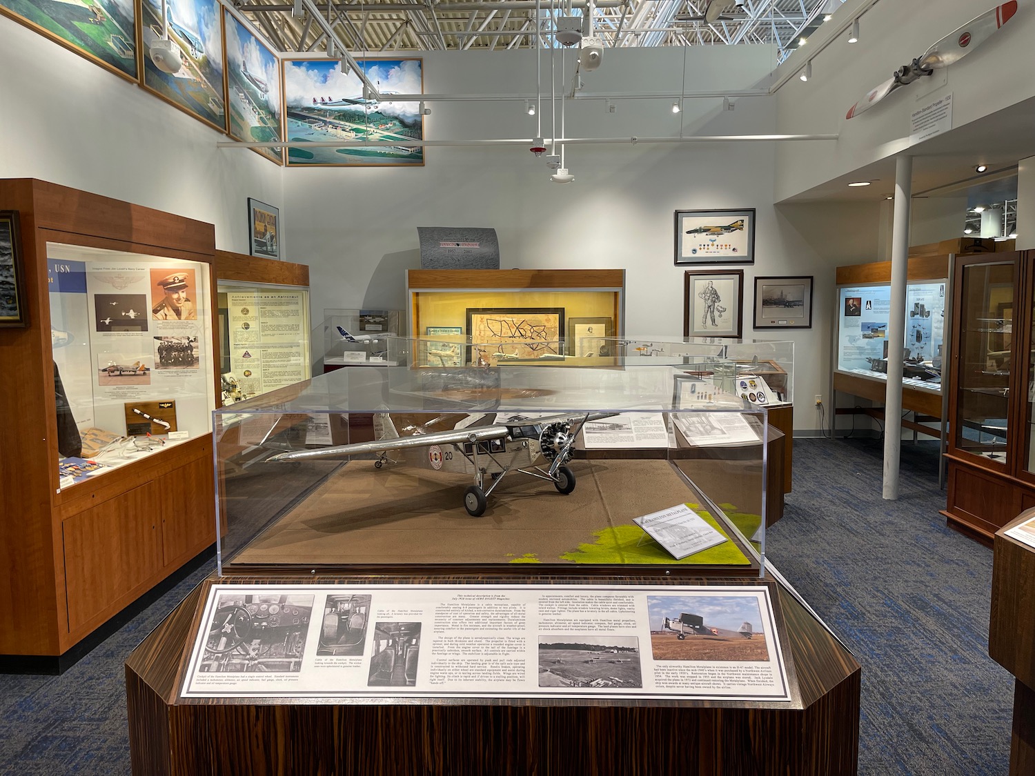 a display case with a model airplane in it