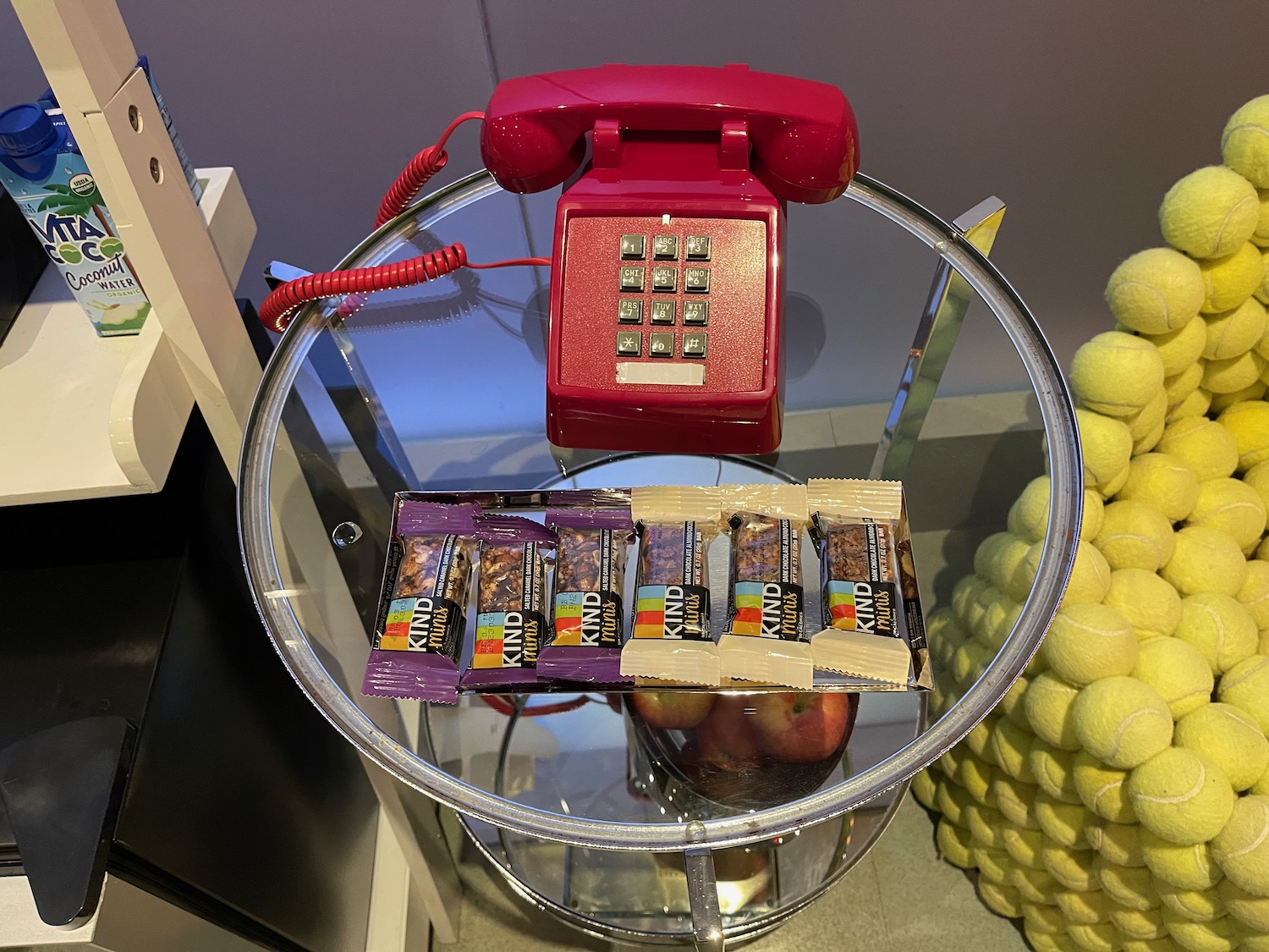 a telephone and candy bars on a glass table