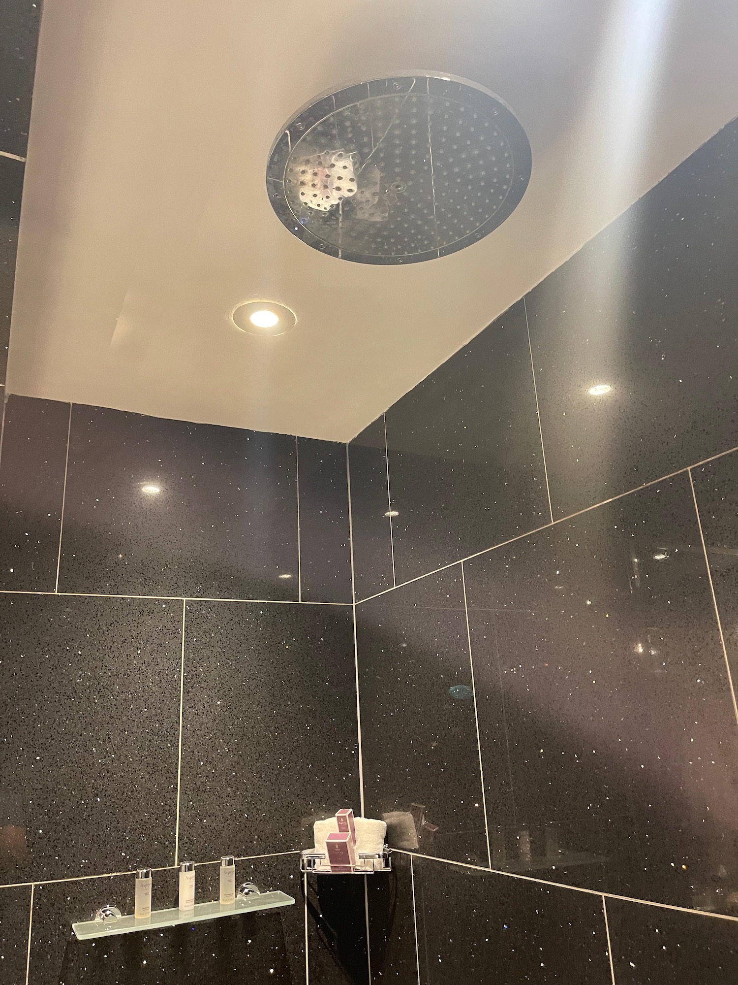 a shower with a round shower head