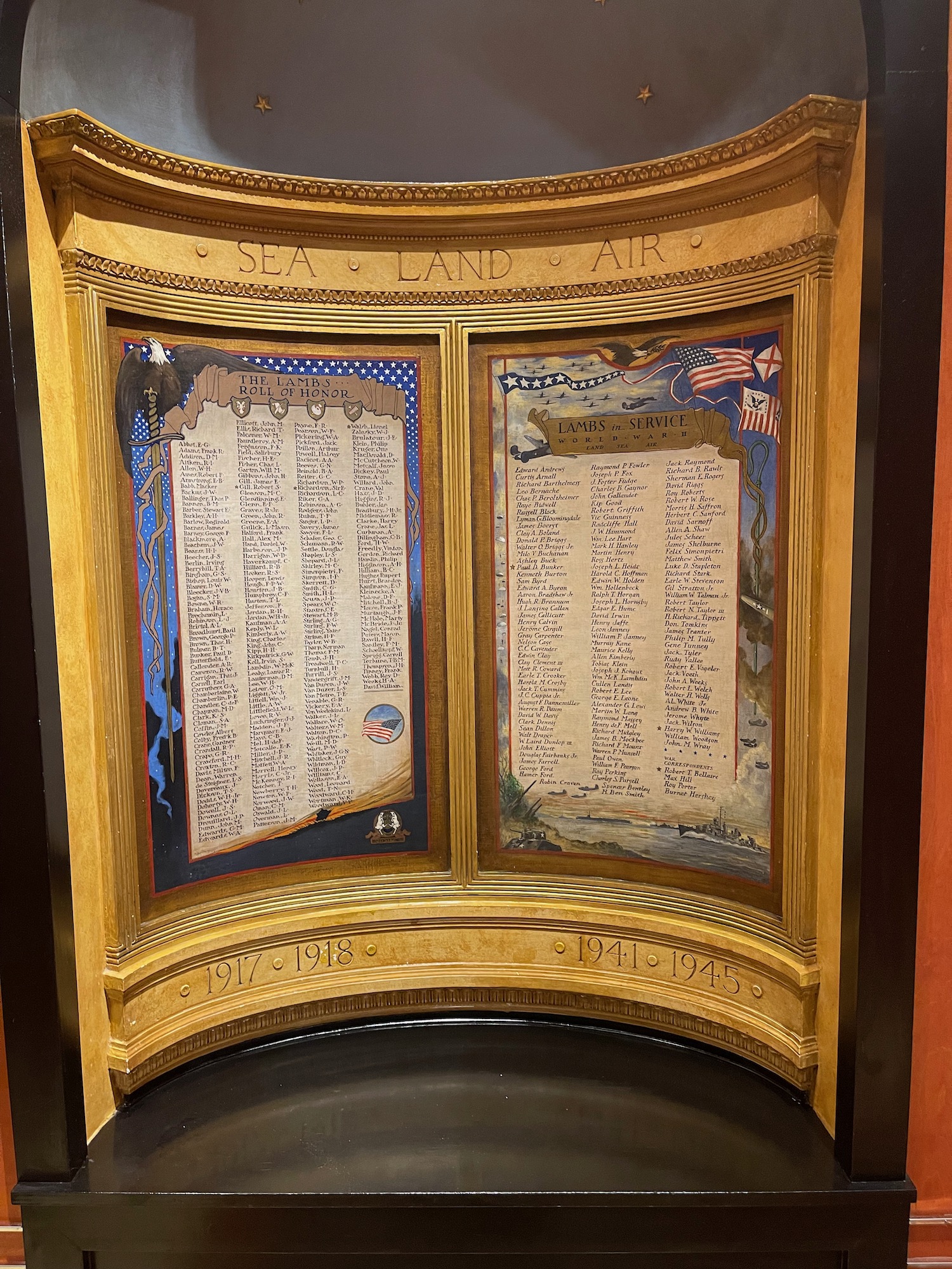 a gold framed display with a couple of writing on it