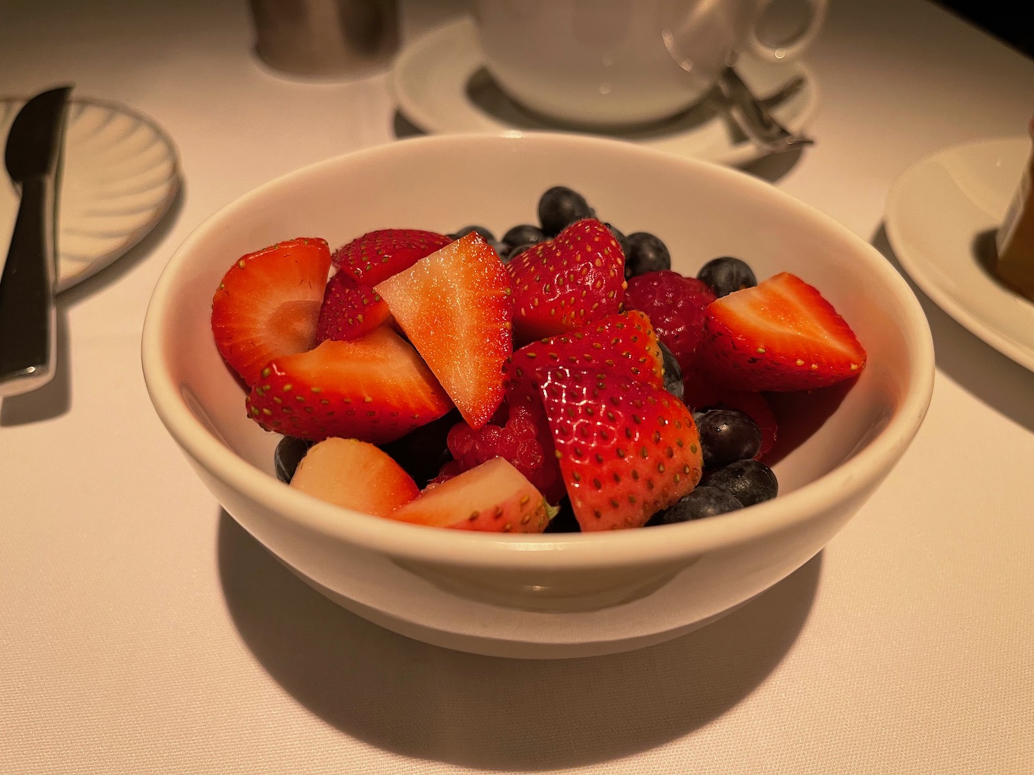 a bowl of fruit on a table