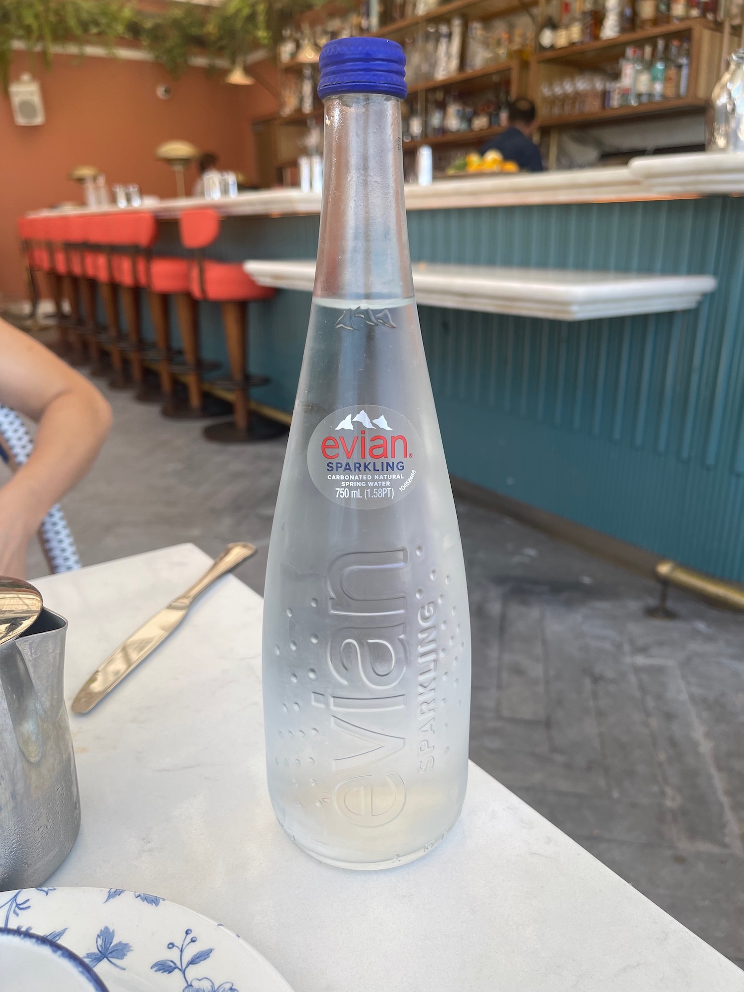 a clear bottle of water on a table