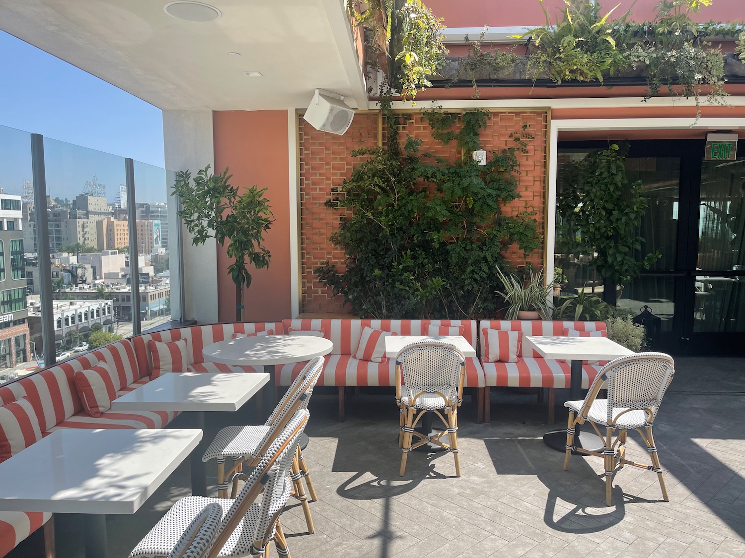 a patio with tables and chairs