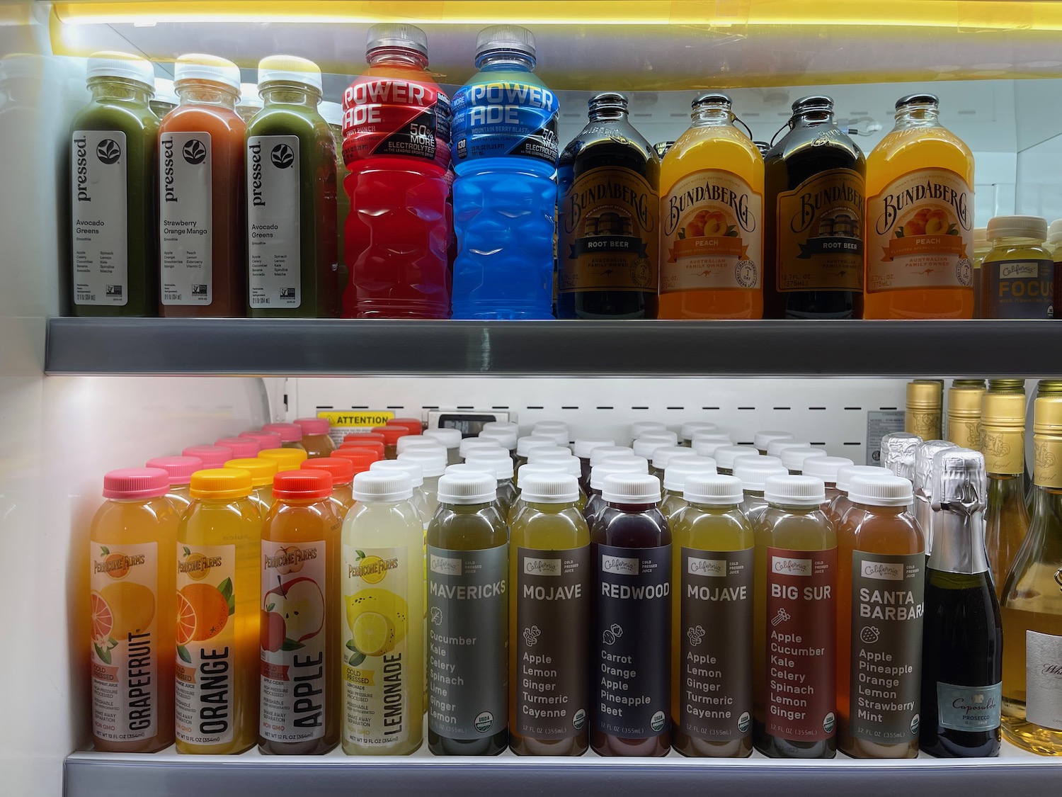 a shelf of drinks on a shelf