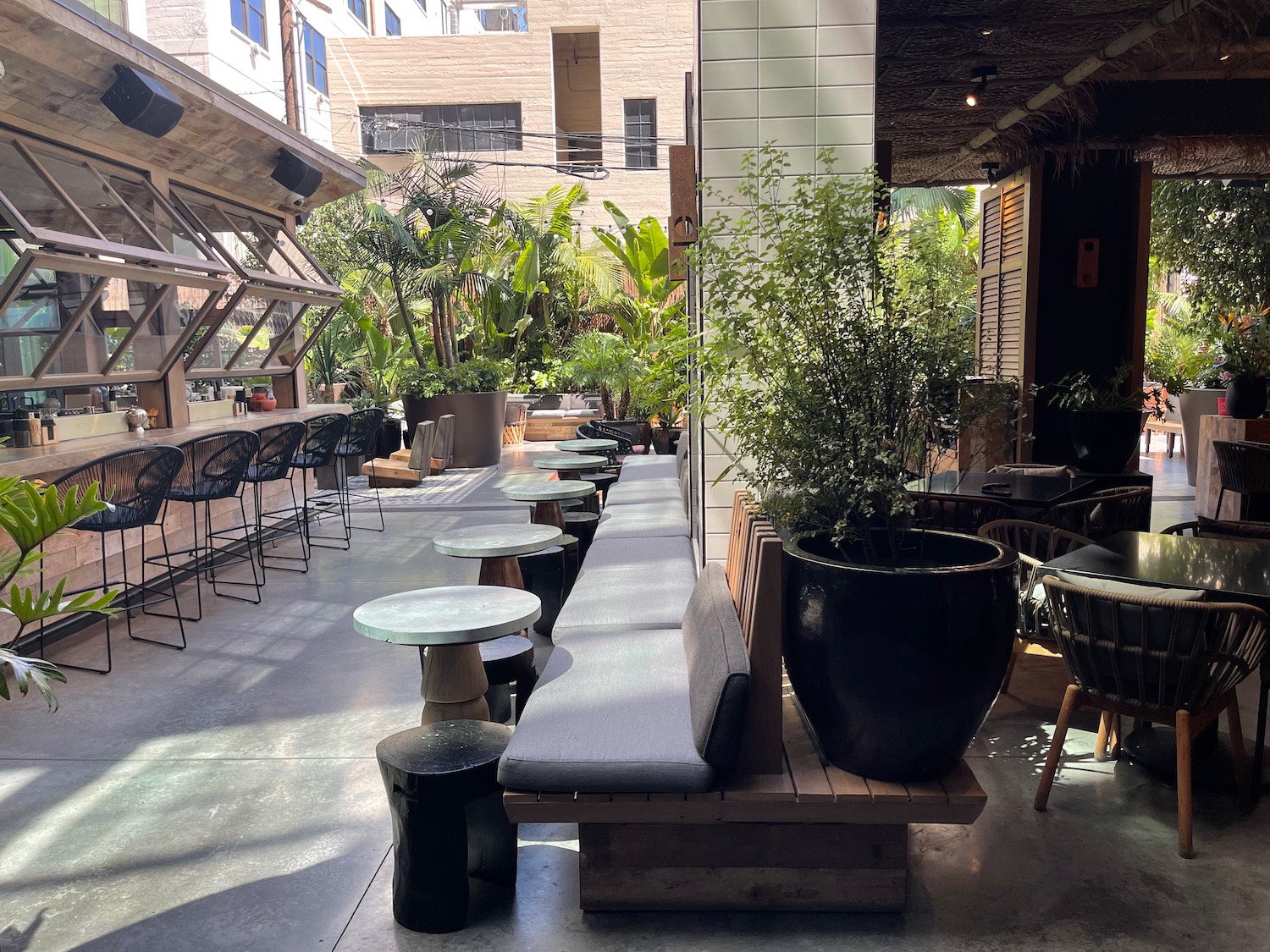 a patio with tables and chairs