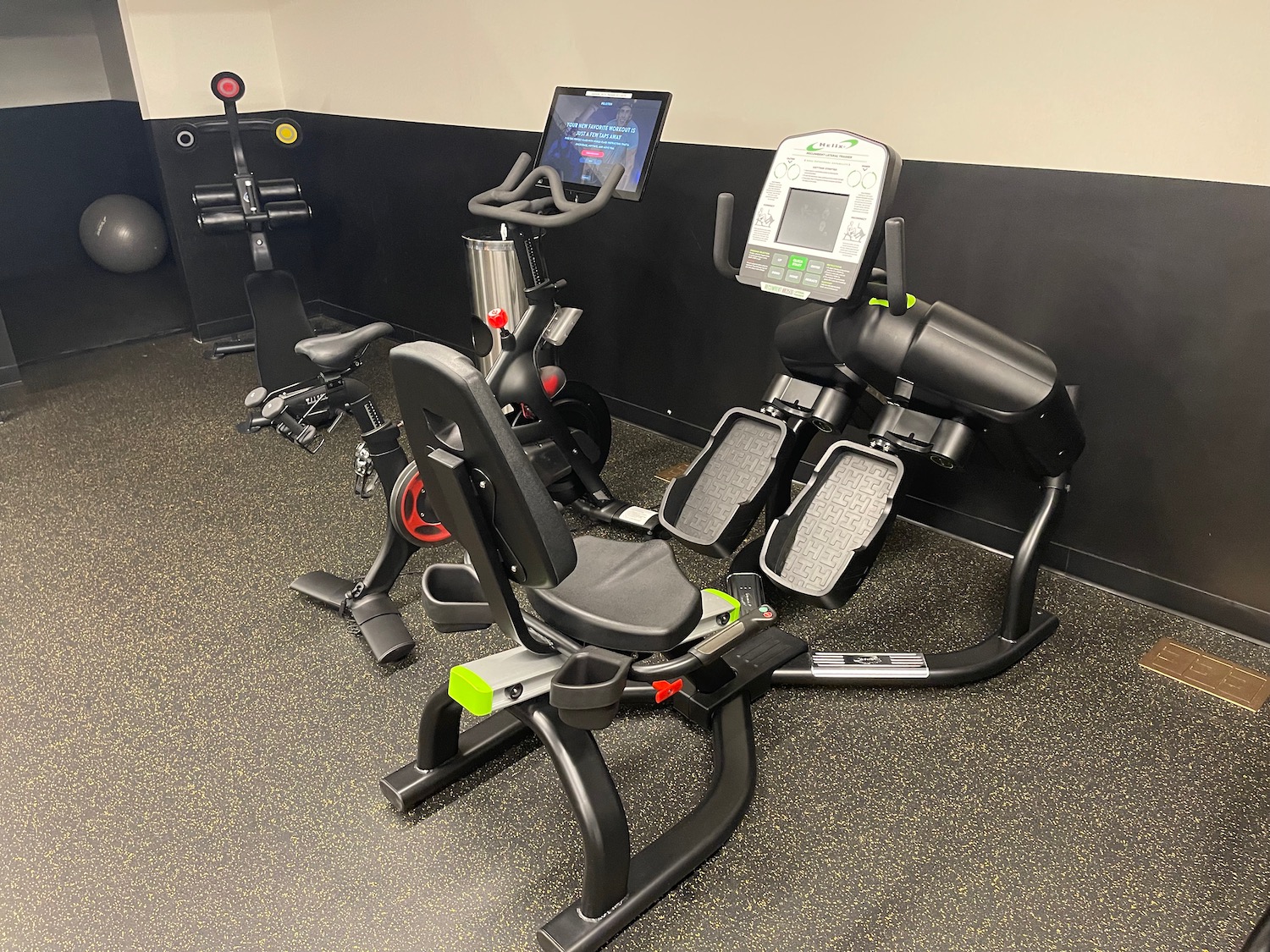 a group of exercise machines in a room