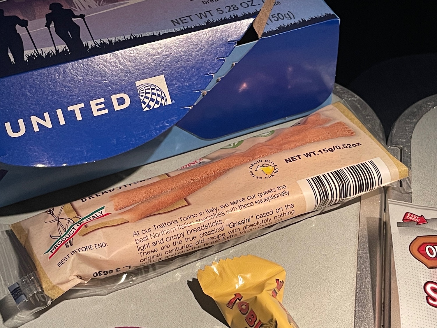 a package of bread sticks and a blue box