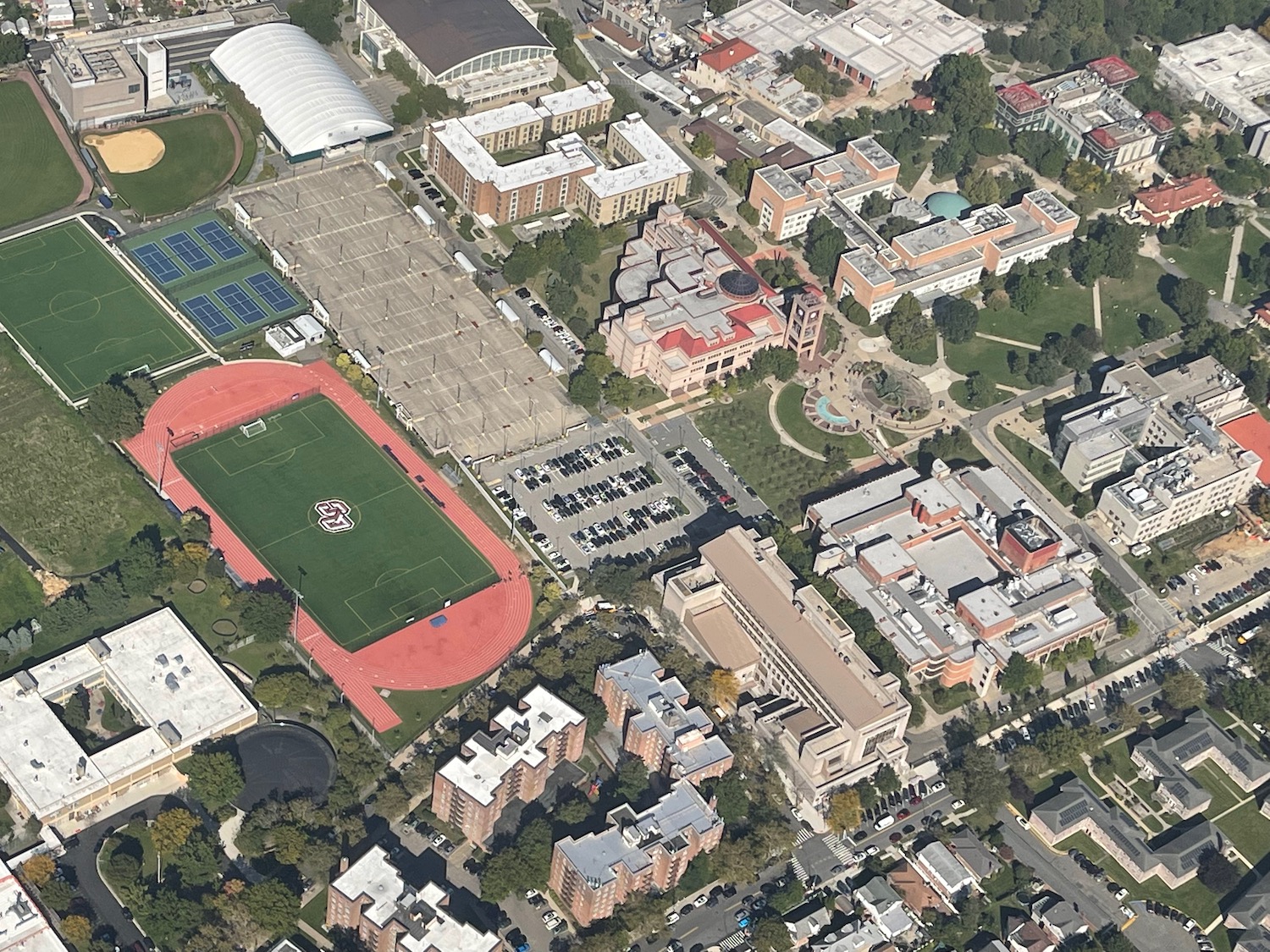an aerial view of a sports field and buildings