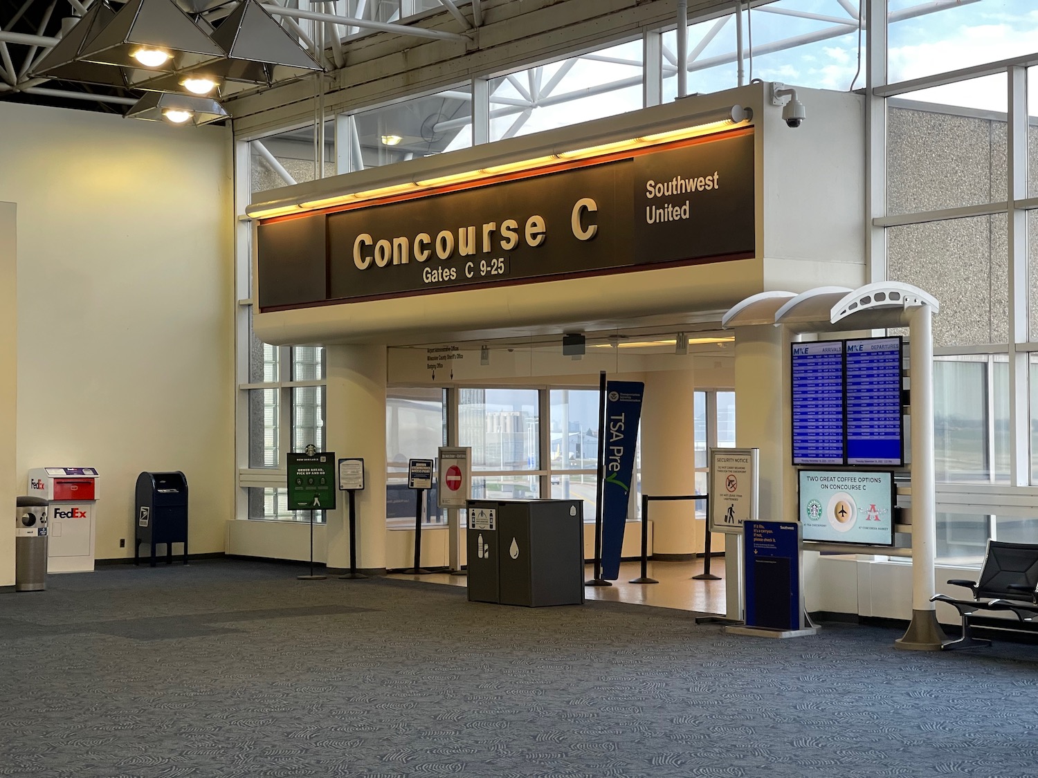 a large airport terminal with signs and information