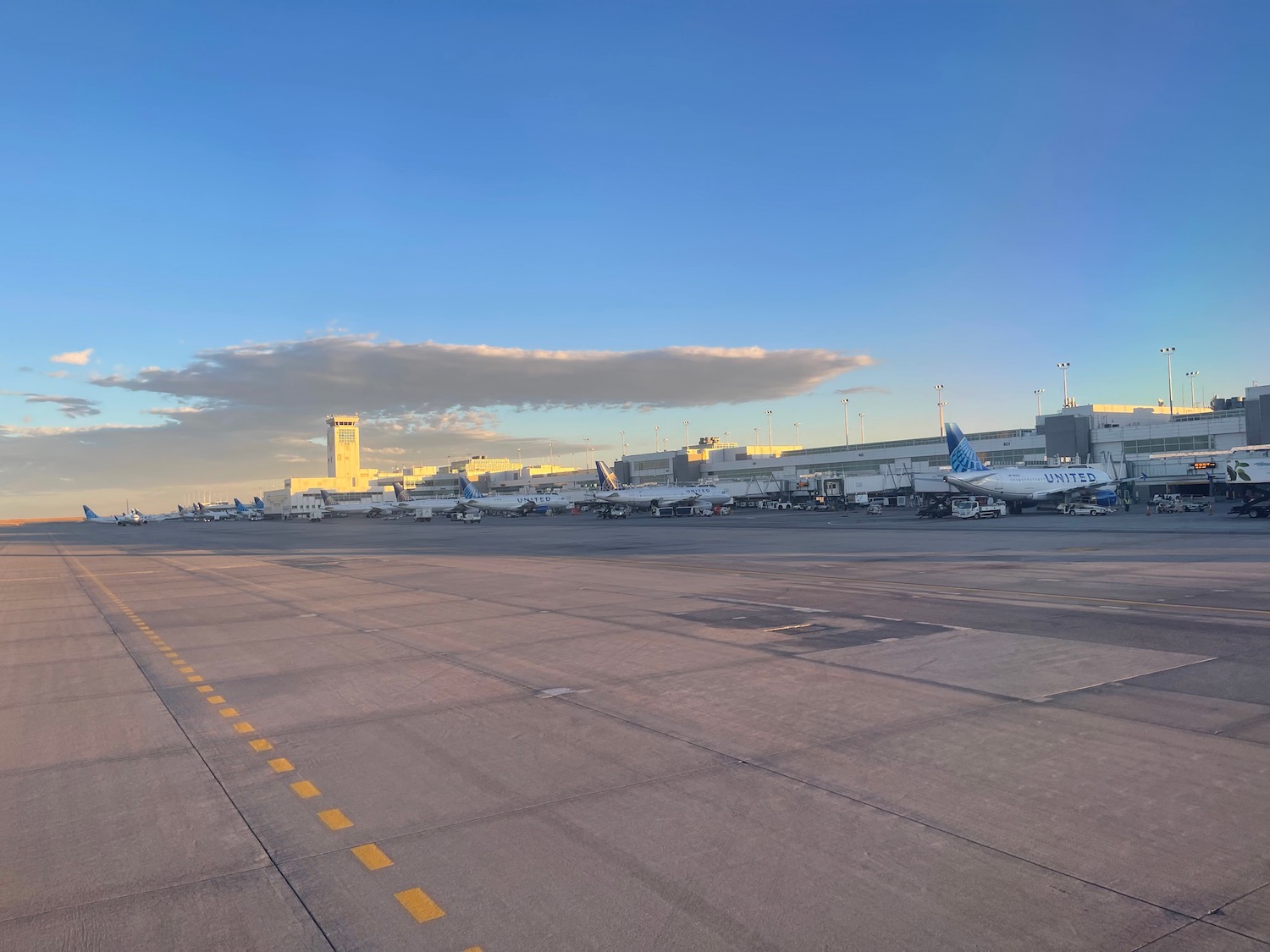 a group of airplanes on a runway