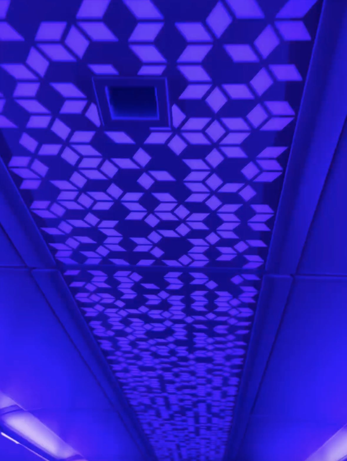 a blue and white ceiling with a pattern on it