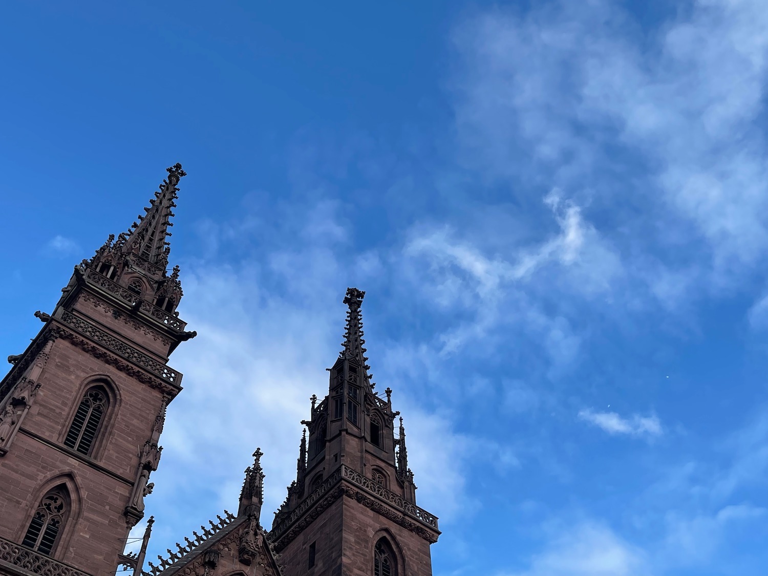 a tall building with spires and blue sky