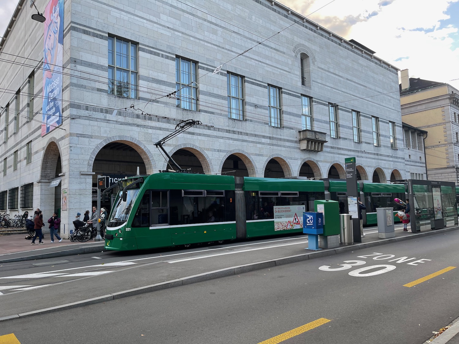 a green train on the street