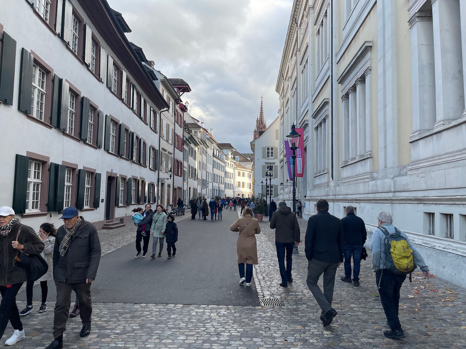 a group of people walking down a street