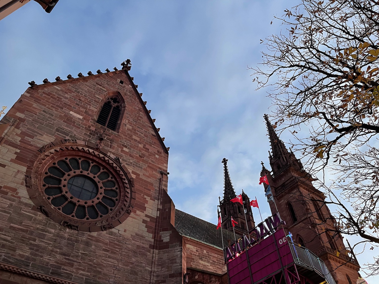 a building with a round window and spires