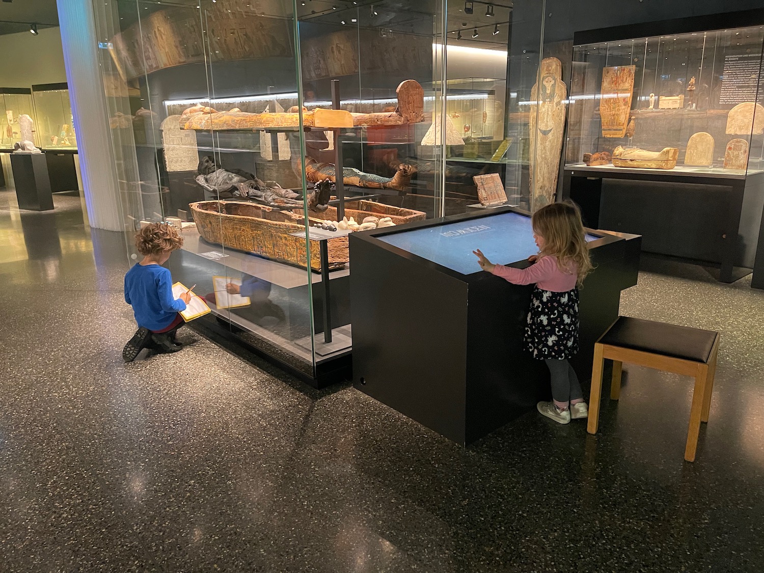 a kids looking at an exhibit