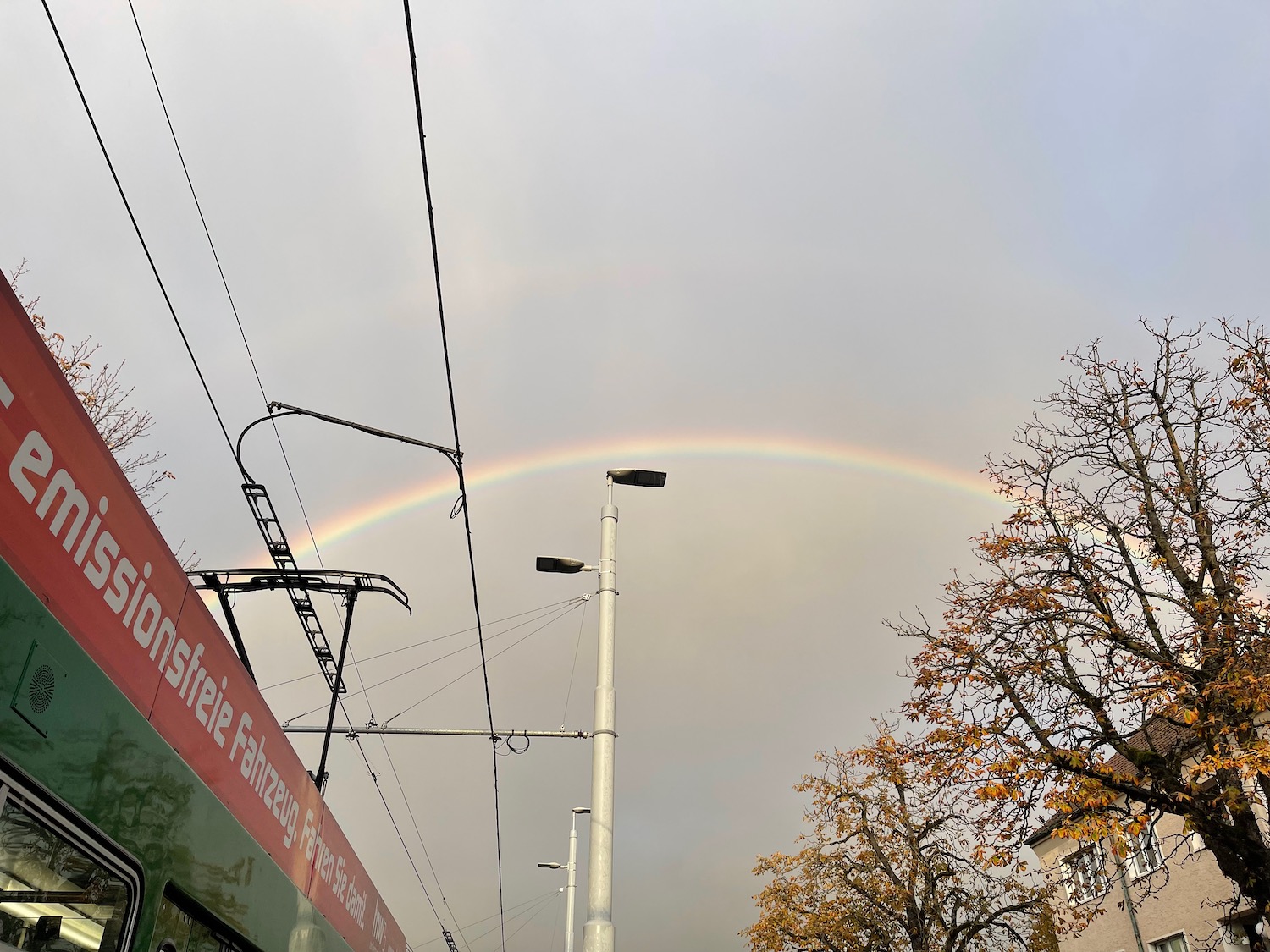 a rainbow over a street light