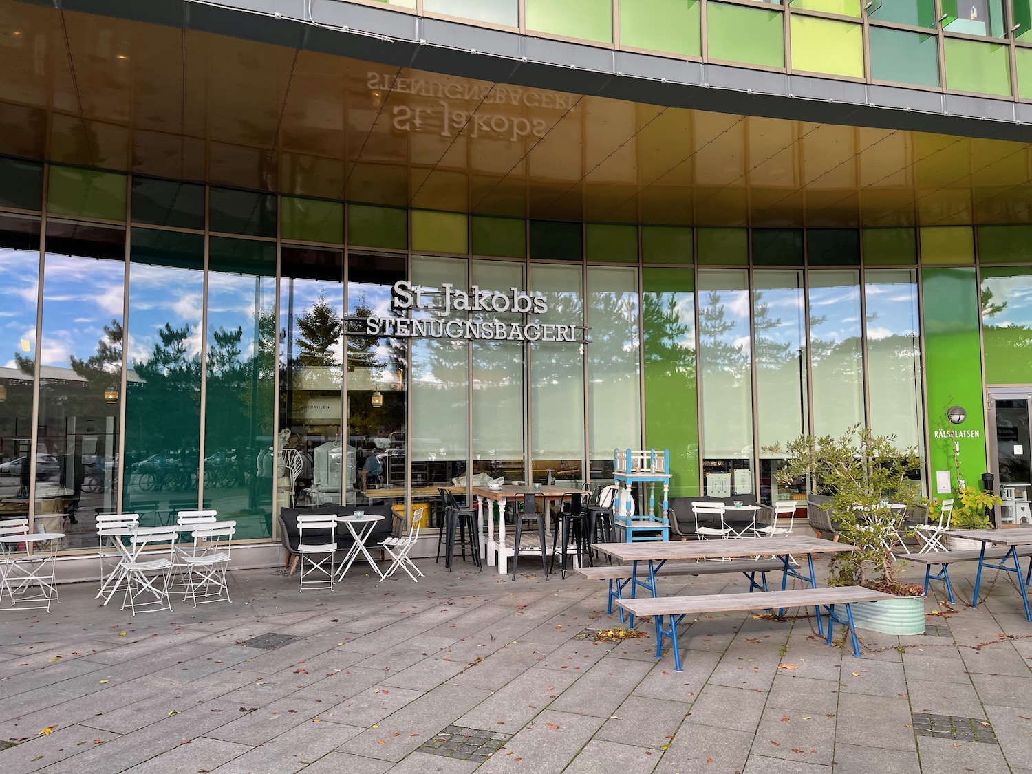 a building with tables and chairs outside