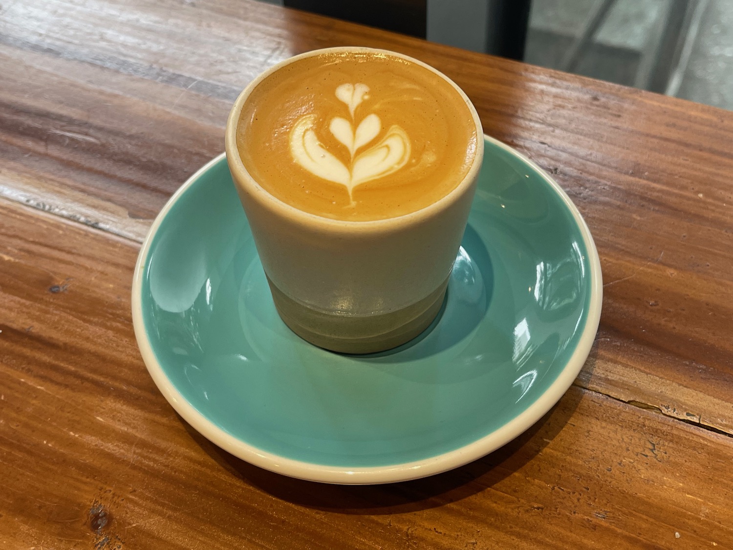 a cup of coffee on a saucer