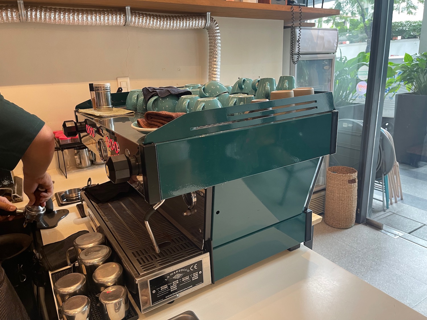 a coffee machine with cups on top