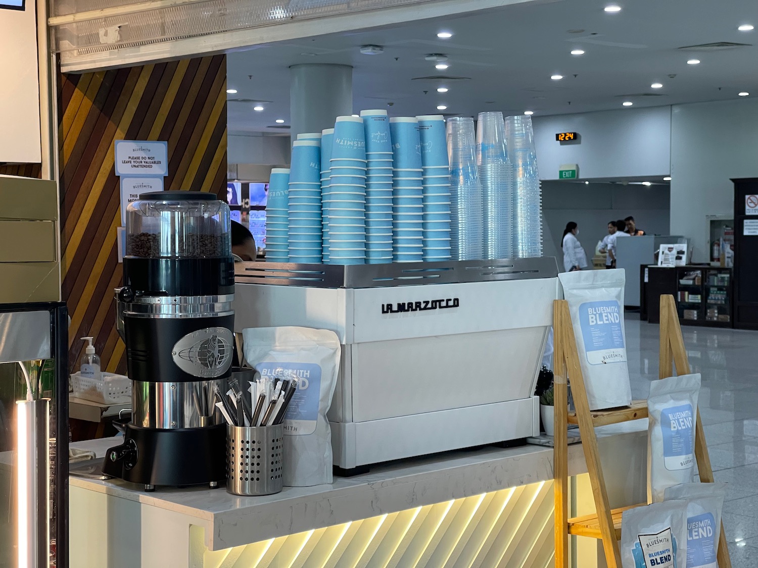 a coffee machine and cups on a counter