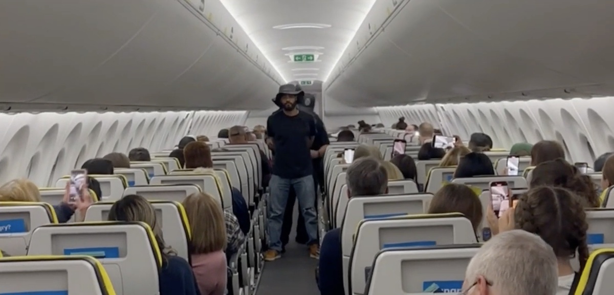 a man standing in an airplane