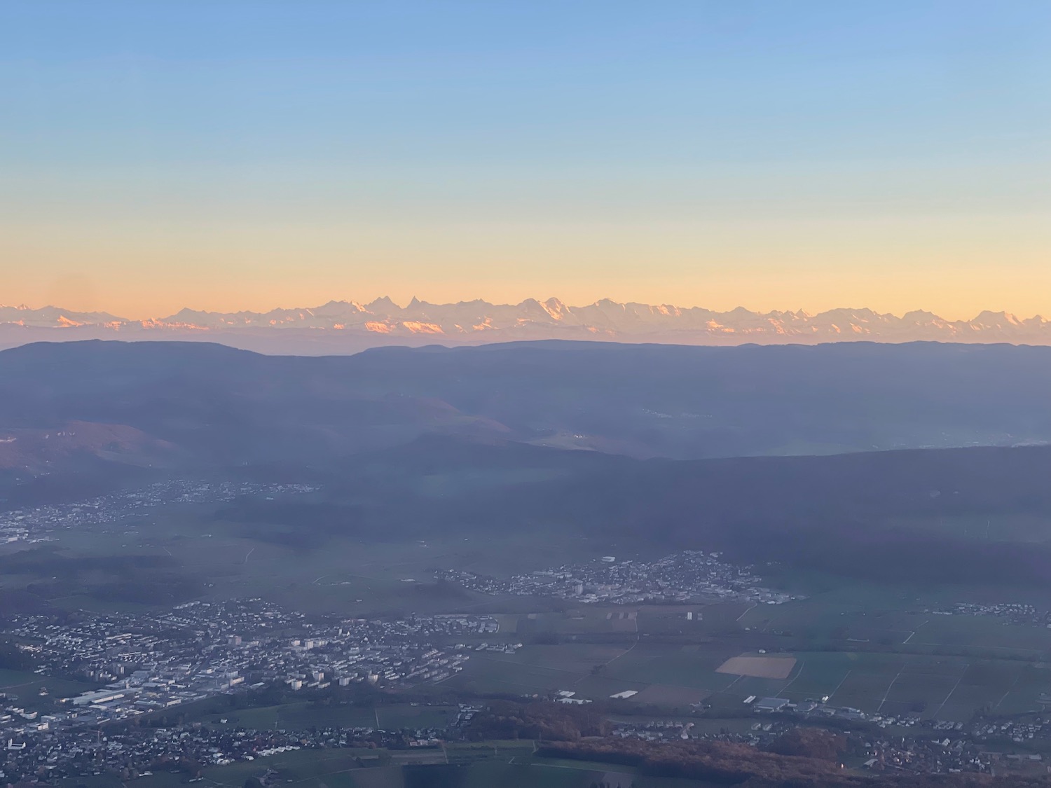 a landscape with mountains in the background