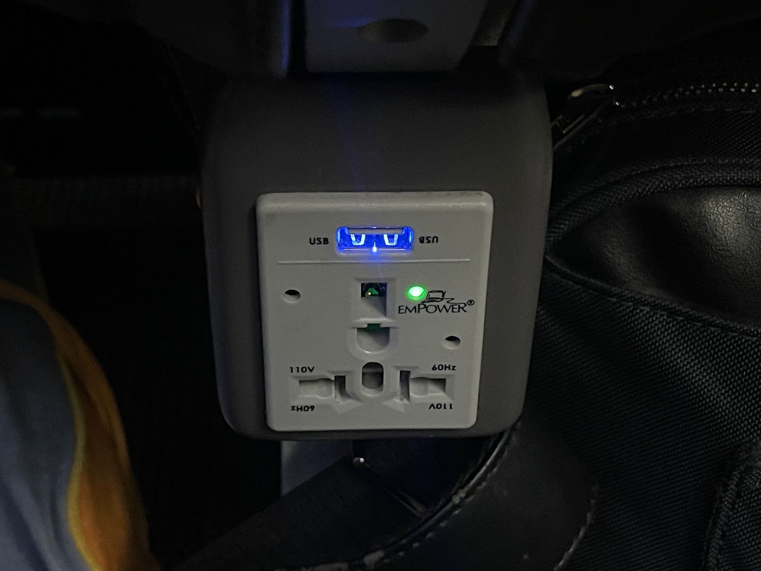a power outlet with a blue light