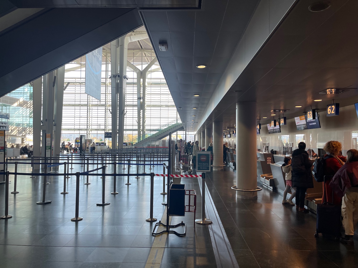 a group of people walking in a building