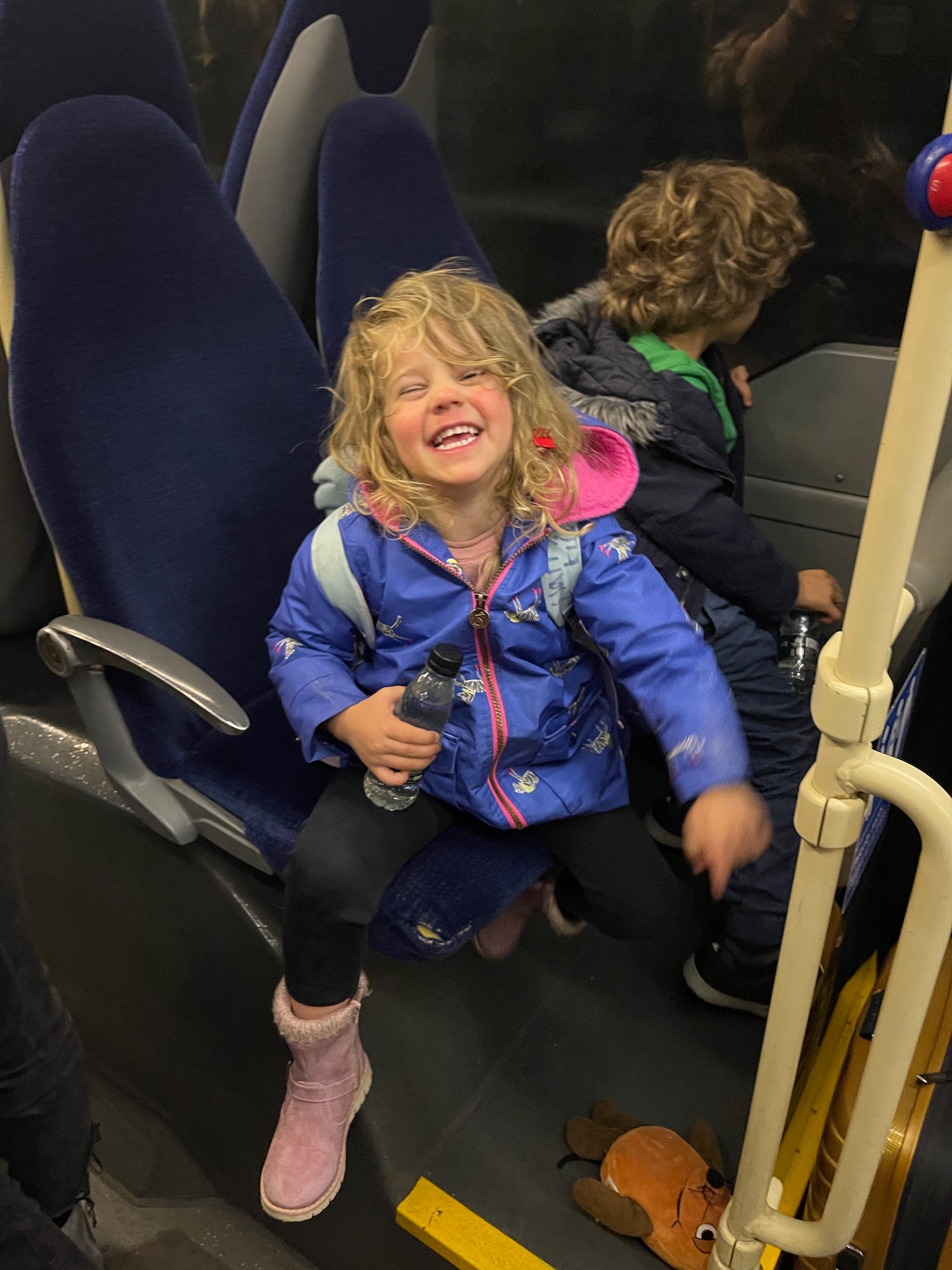 a girl sitting on a bus