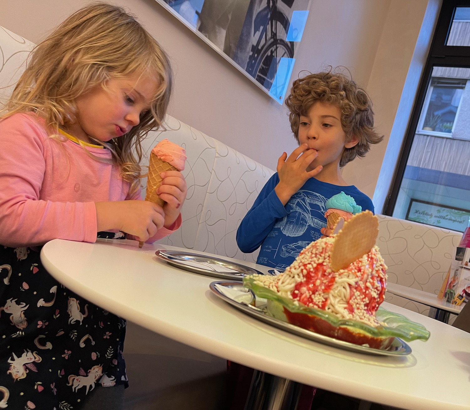 a boy and girl eating ice cream