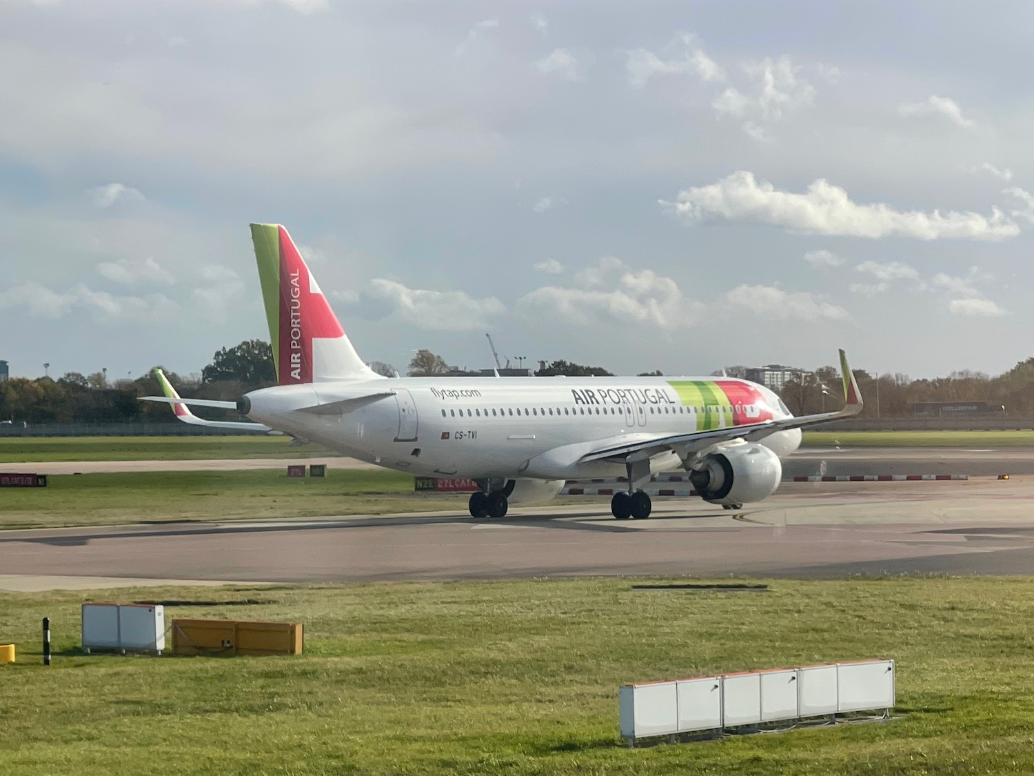 a white airplane on a runway