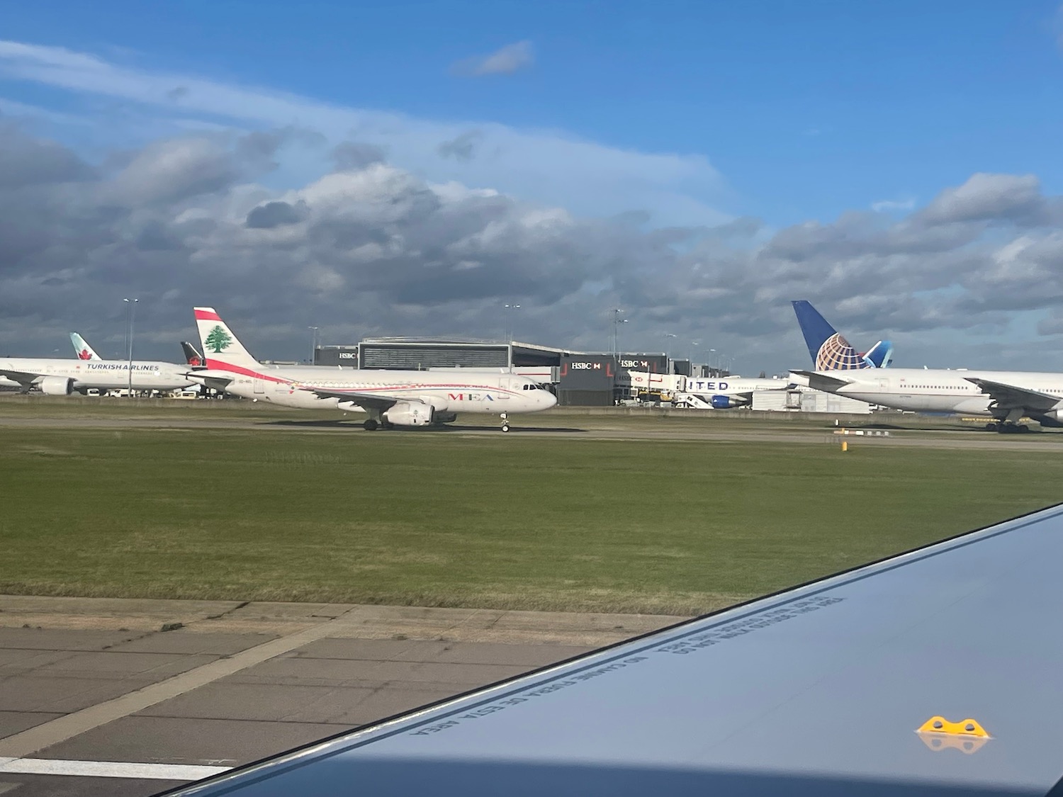 a group of airplanes on a runway