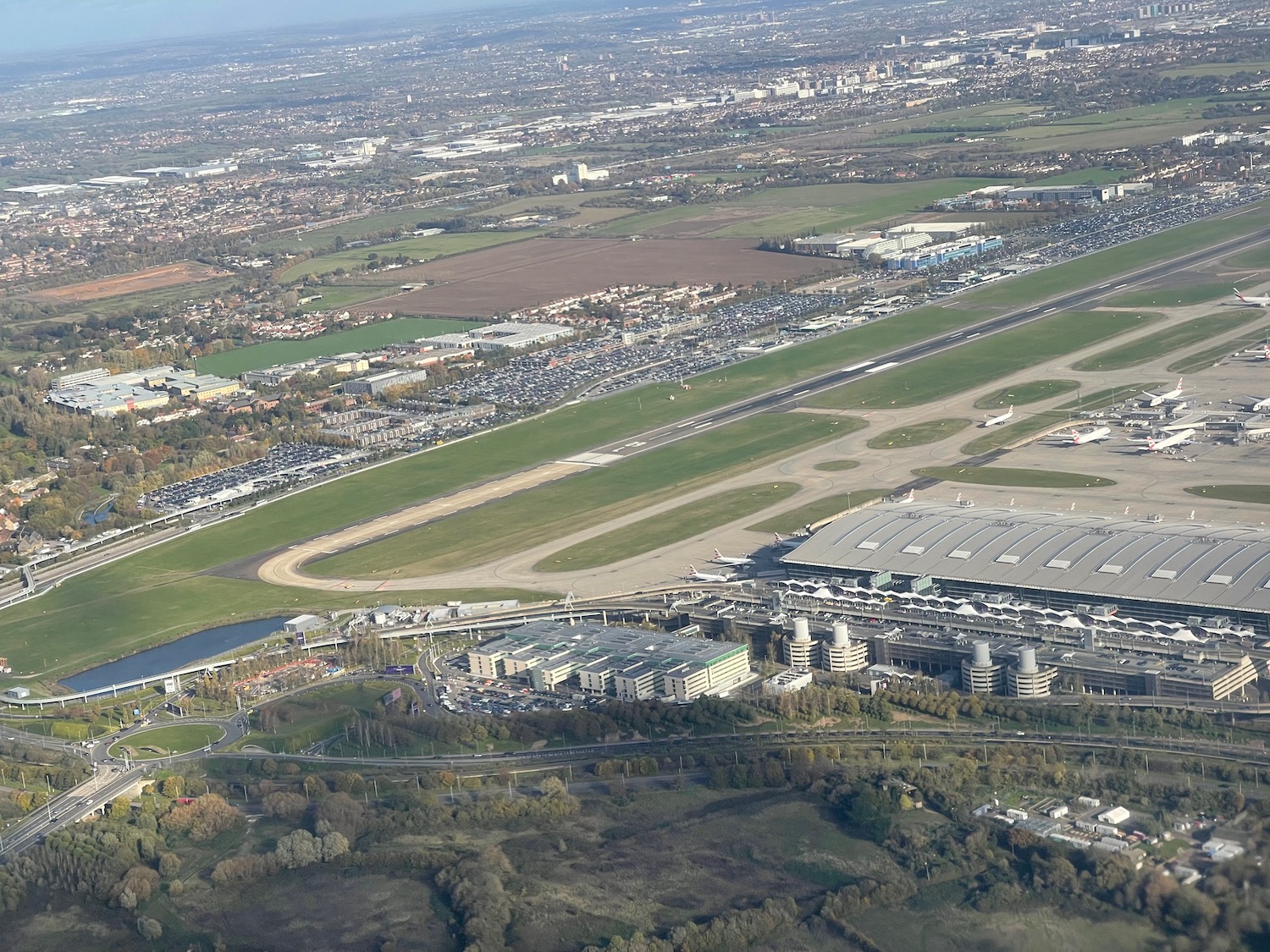 an aerial view of a runway and buildings