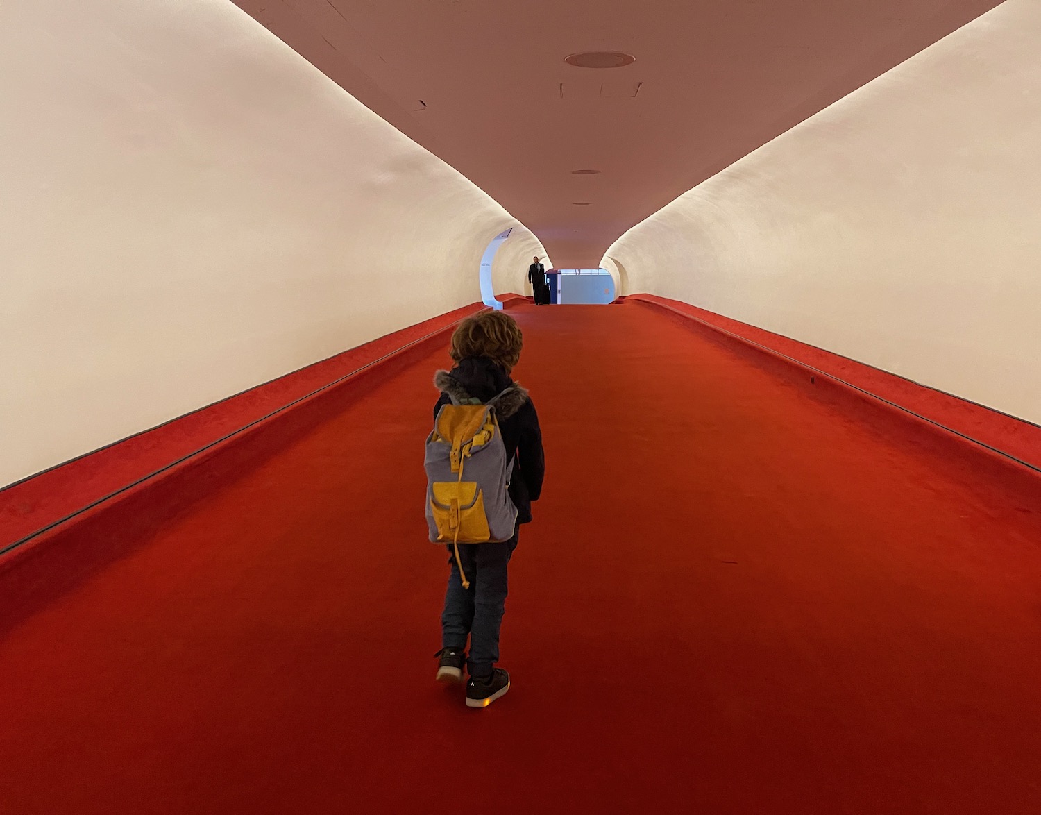 a child walking in a tunnel