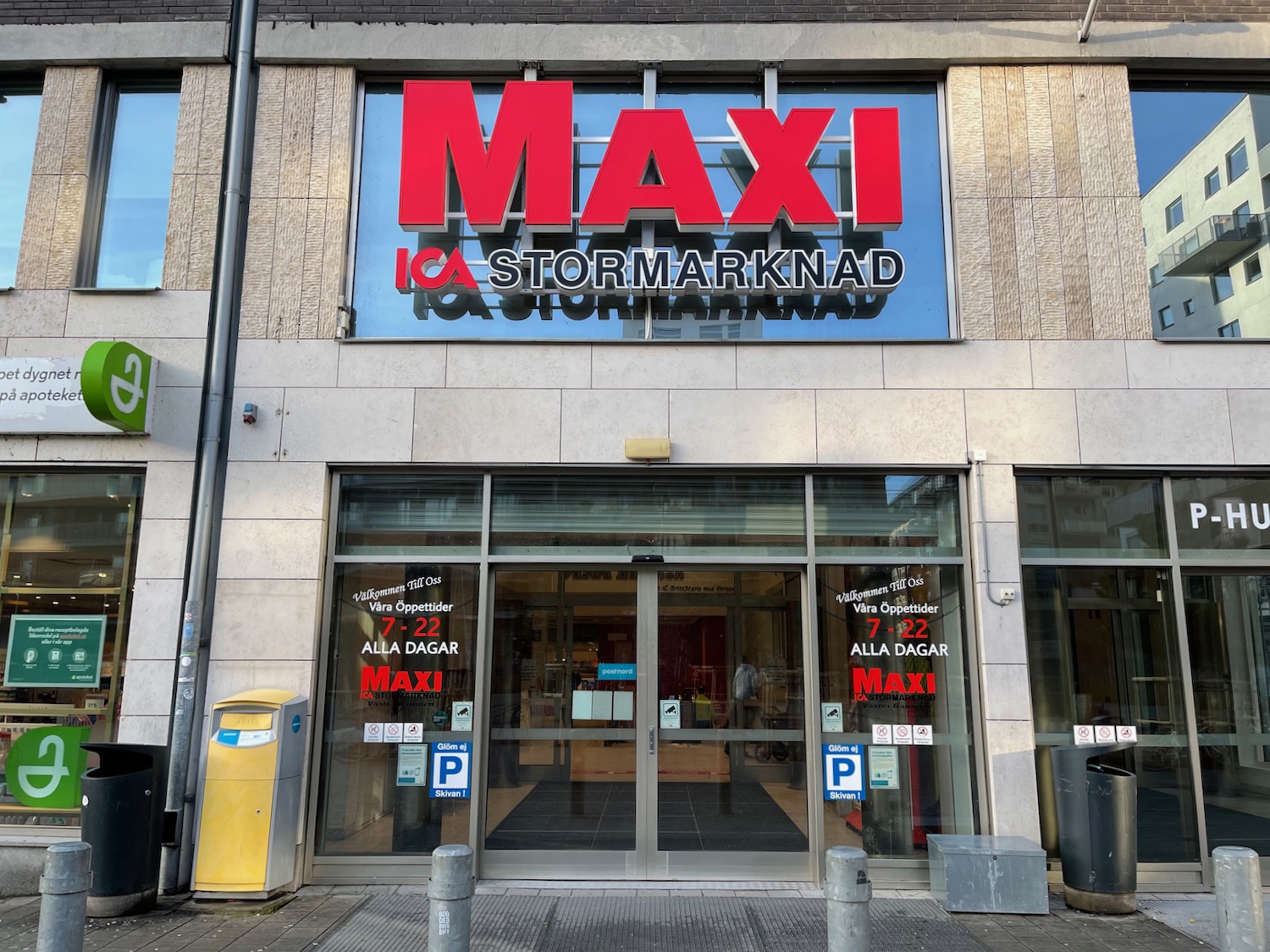 a building with glass doors and a sign