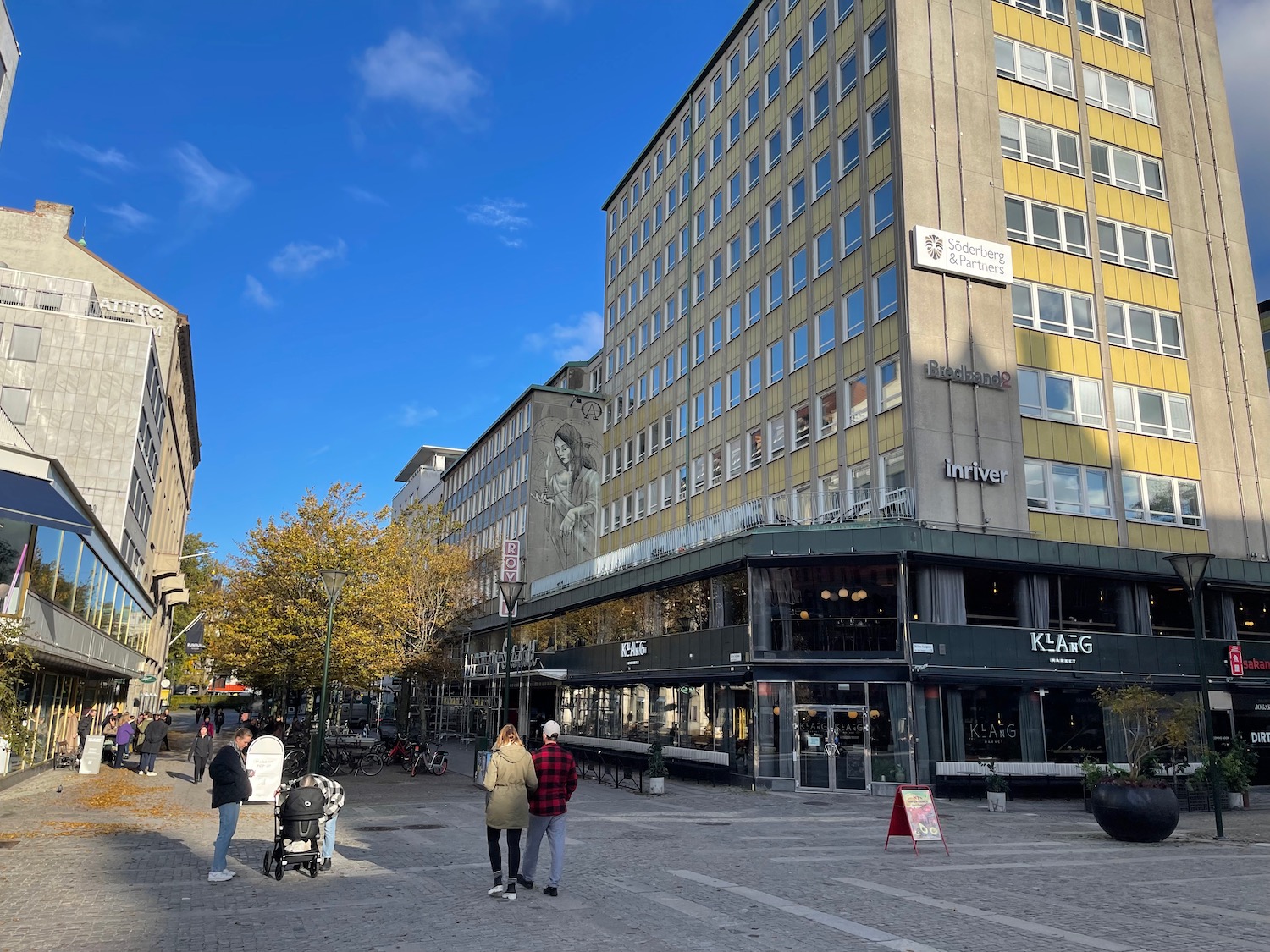 a group of people walking in a city