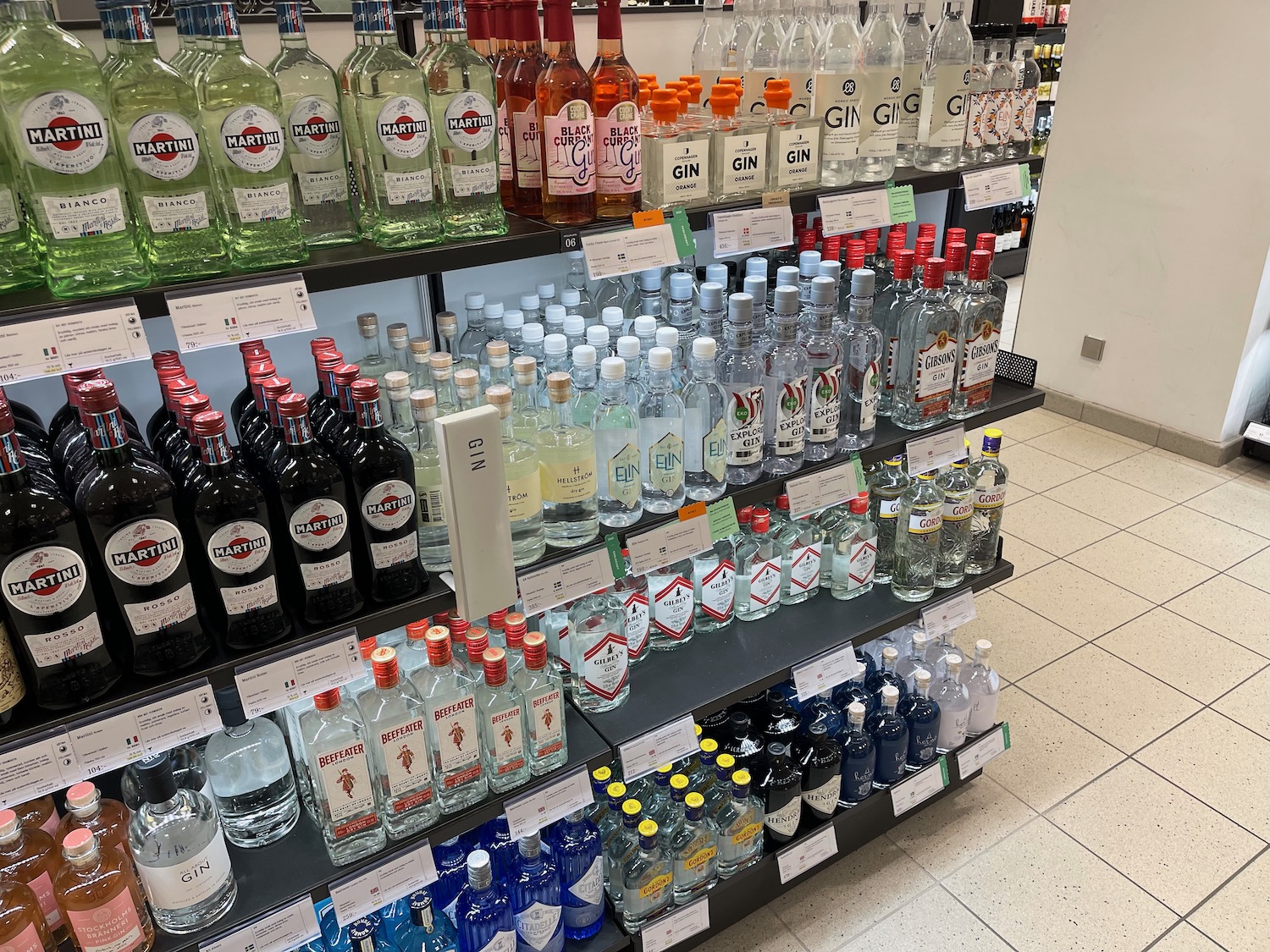 a shelf of liquor bottles