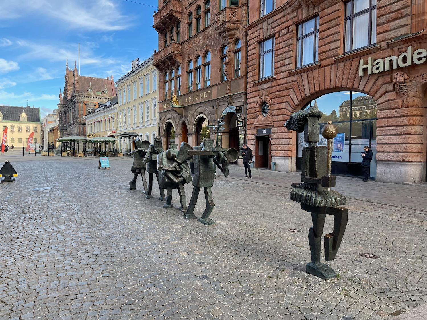 a group of statues in a street