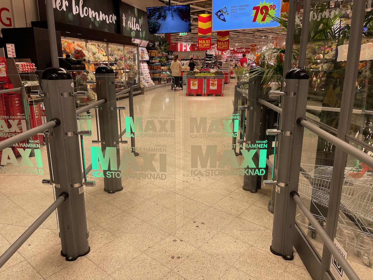 a glass entrance to a grocery store