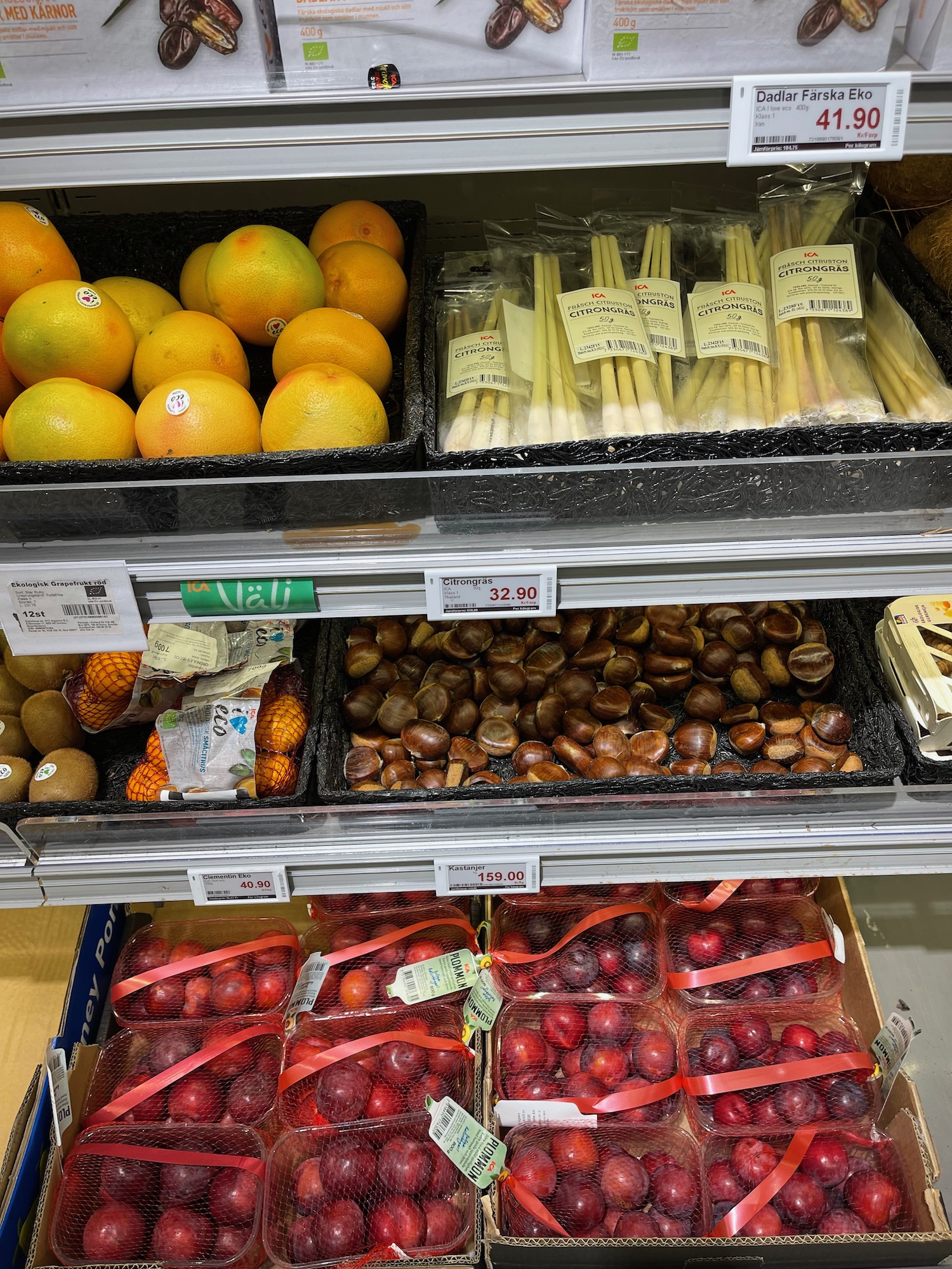 a shelf with fruits and vegetables