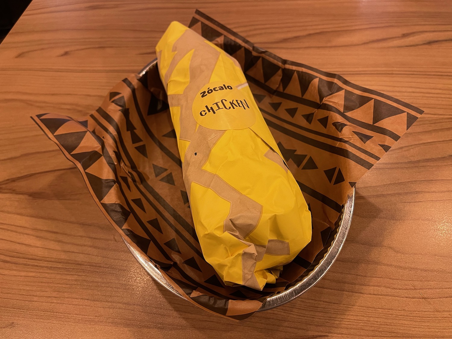 a burrito in a paper wrapper