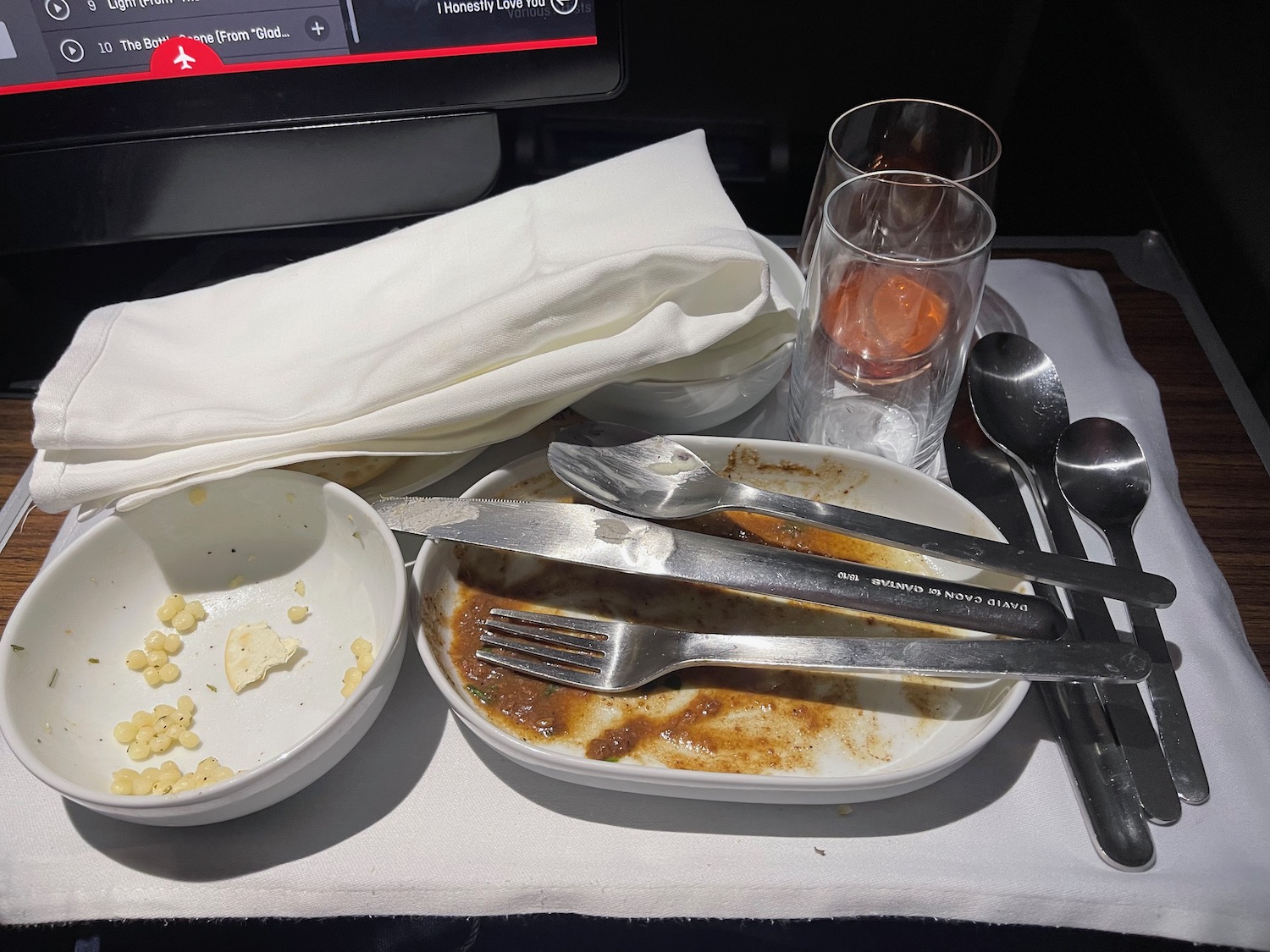 a plate of food and a glass of liquid on a table