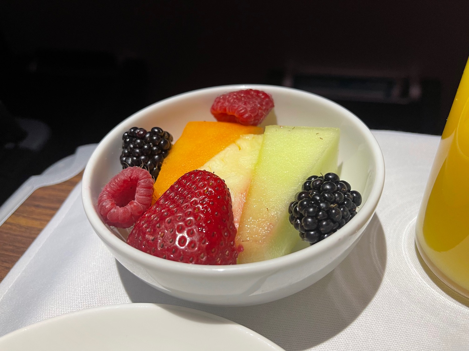 a bowl of fruit on a table