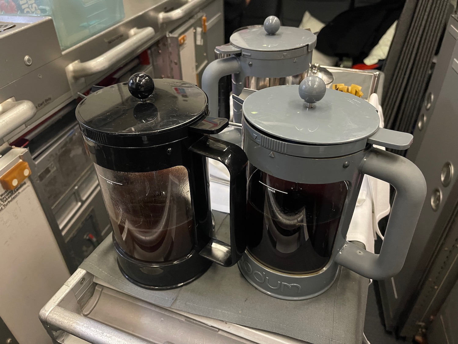 a group of coffee maker on a tray